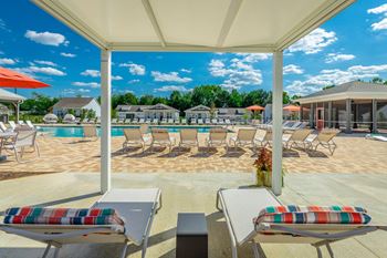 poolside cabanas and chaise lounges  at Anthem Apartments and Luxury Rental Homes in Huntsville, AL